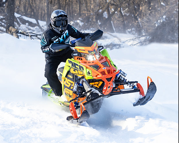 Medium shot of a guy on a snowmobile wearing FXR Men's Renegade FX 2-in-1 Jacket